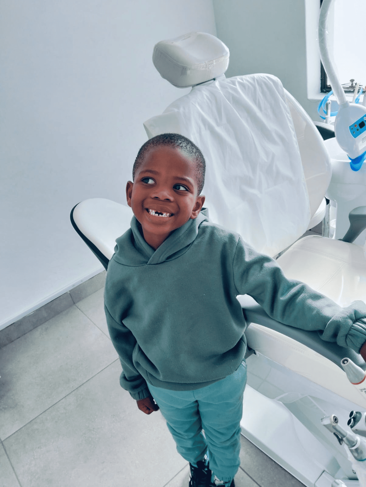 Smiling young child visiting a dental practice